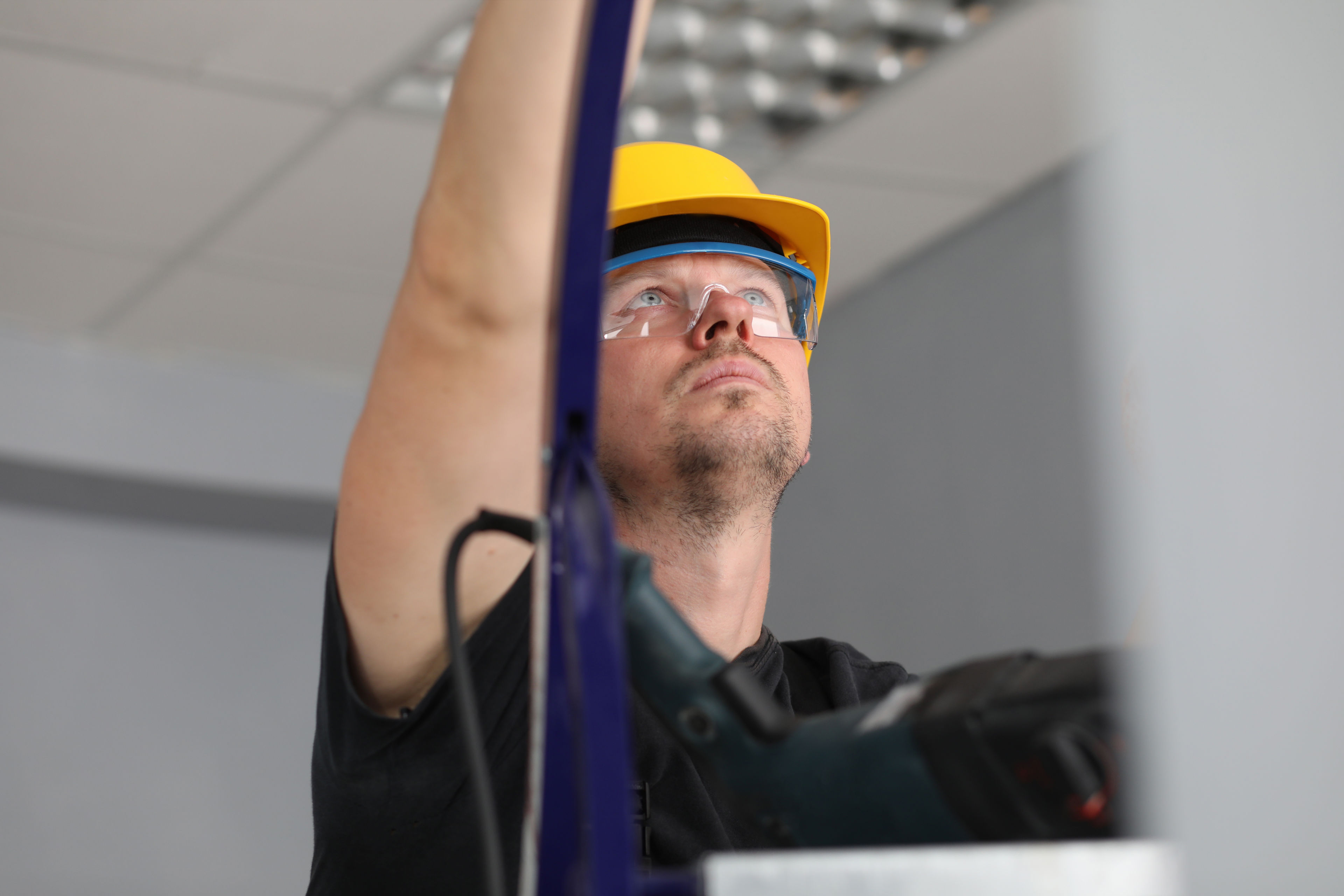 Håndværker på stige