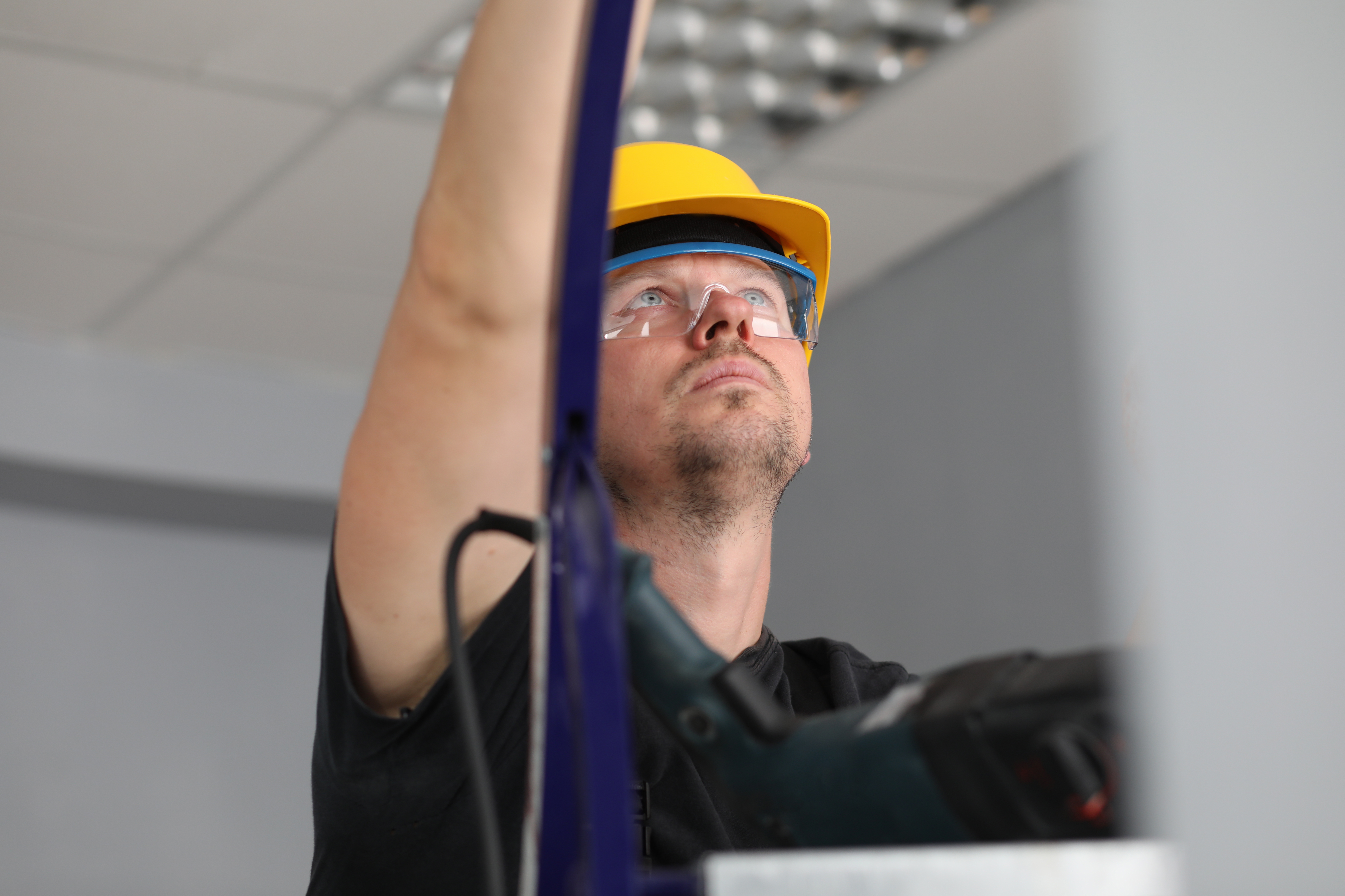 Håndværker på stige