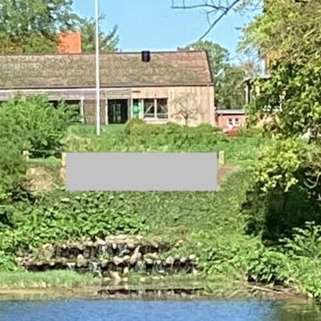Den døde grav ved Nyborg Vold - grå skraveret felt over blomsterbedet // Foto: Nyborg Kommune